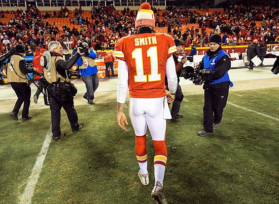 Chiefs quarterback Alex Smith walks off the field at Arrowhead Stadium after last Saturday's playoff loss to the Titans