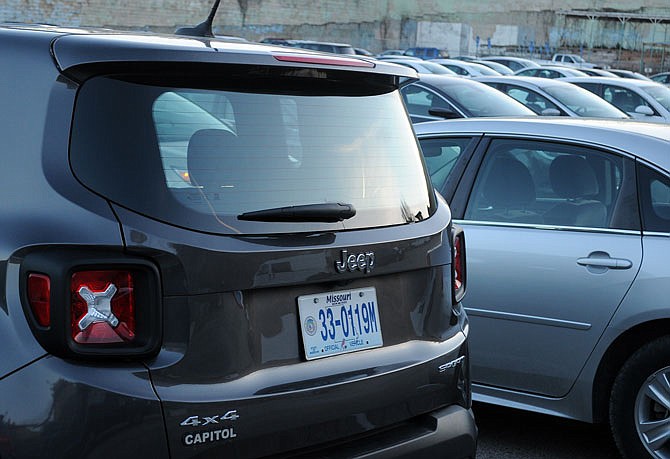 A state owned fleet of cars is at a lot near the Missouri State Penitentiary. Gov. Eric Greitens announced 30 cars in the state's pool will be sold. 