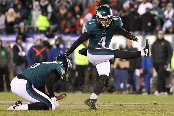 Eagles kicker Jake Elliott attempts a field goal as Donnie Jones holds during the first half of Saturday's NFC divisional playoff game against the Falcons in Philadelphia.
