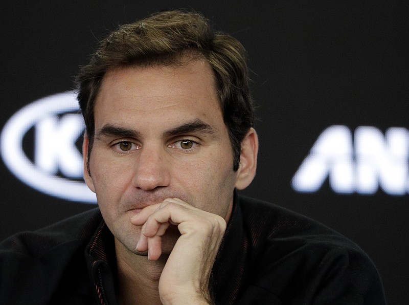 Switzerland's Roger Federer answers questions during a press conference at the Australian Open tennis championships Sunday in Melbourne, Australia.