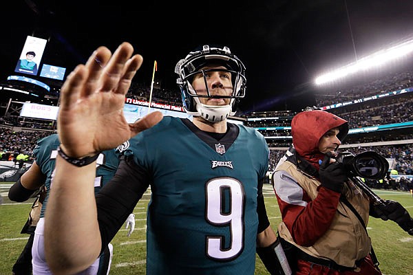 Eagles quarterback Nick Foles celebrates after Saturday's NFC divisional playoff game against the Falcons in Philadelphia. The Eagles won 15-10.