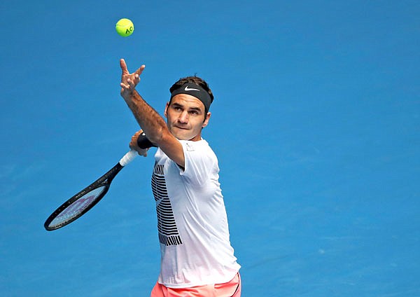 Roger Federer serves during Saturday's practice session ahead of the Australian Open in Melbourne, Australia.