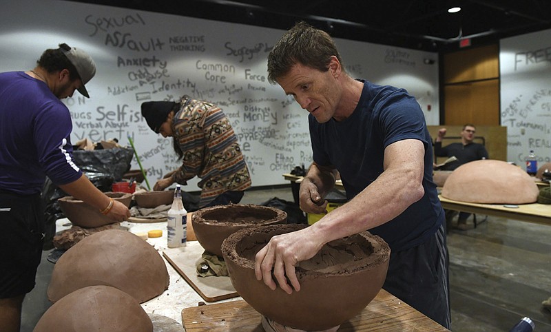  Steve Hilton, a ceramicist and art education faculty member at Midwestern State University in Wichita Falls, Texas, works on one of the 40 clay spheres on Jan. 11 that is part of an exhibit he is creating with help from students and others in the Nancy Fife Cardozier Gallery in the Charles A. Sorber Visual Arts Studios at the University of Texas of the Permian Basin in Odessa, Texas. 