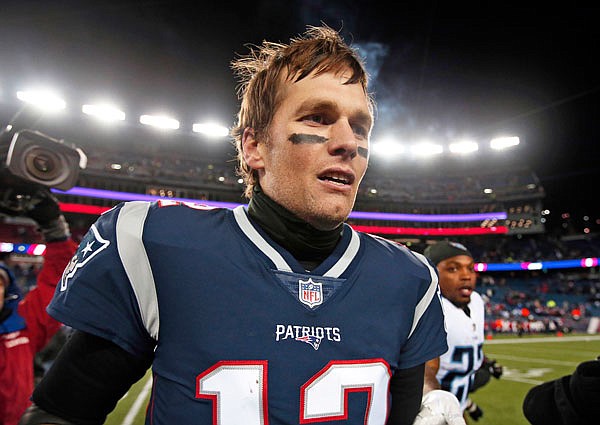 Patriots quarterback Tom Brady leaves the field after Saturday's AFC divisional playoff game against the Titans in Foxborough, Mass.