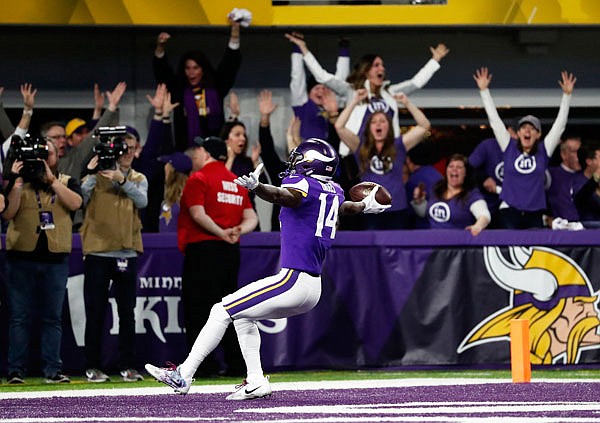 Vikings wide receiver Stefon Riggs runs into the end zone for a game-winning touchdown against the Saints on the final play of Sunday's NFC divisional playoff game in Minneapolis. The Vikings defeated the Saints 29-24 and will play the Philadelphia Eagles next weekend for the NFC crown.