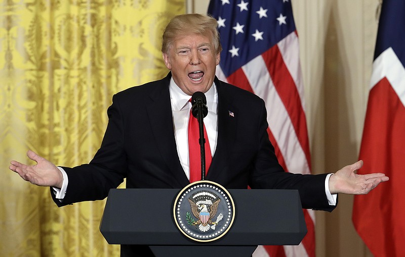 FILE - In this Jan. 10, 2018, file photo, President Donald Trump speaks during a news conference in the East Room of the White House in Washington. The Trump administration is preparing to withhold tens of millions of dollars from the U.N. agency for Palestinian refugees, cutting the year's first contribution by more than half or perhaps entirely, and making additional donations contingent on major changes to the organization, according to U.S. officials. (AP Photo/Evan Vucci, File)