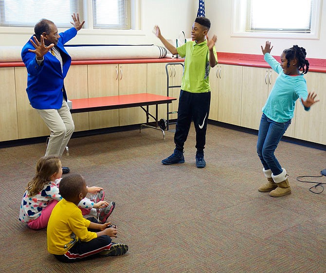 Bobby Norfolk, of St. Louis, visited the Callaway County Public Library on Monday night to dance with the locals and regale them in the persona of famed ragtime musician Scott Joplin. Brynn Bynum, center, and his cousin, Taji Braxton, gave the dance lesson their all.