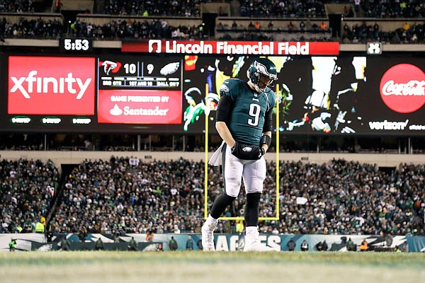 Eagles quarterback Nick Foles walks the field during the second half of Saturday's game against the Falcons in Philadelphia.