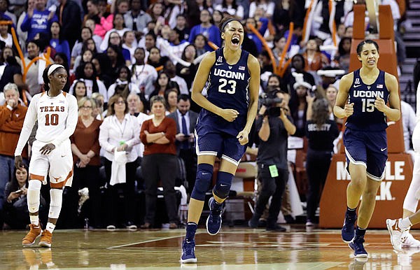 Connecticut forward Azura Stevens (center) celebrates the team's win Monday against Texas in Austin, Texas.