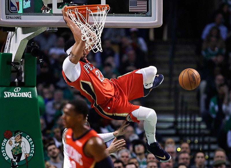 New Orleans Pelicans forward Anthony Davis slams a dunk during the first quarter of an NBA basketball game against the Boston Celtics in Boston, Tuesday, Jan. 16, 2018. 