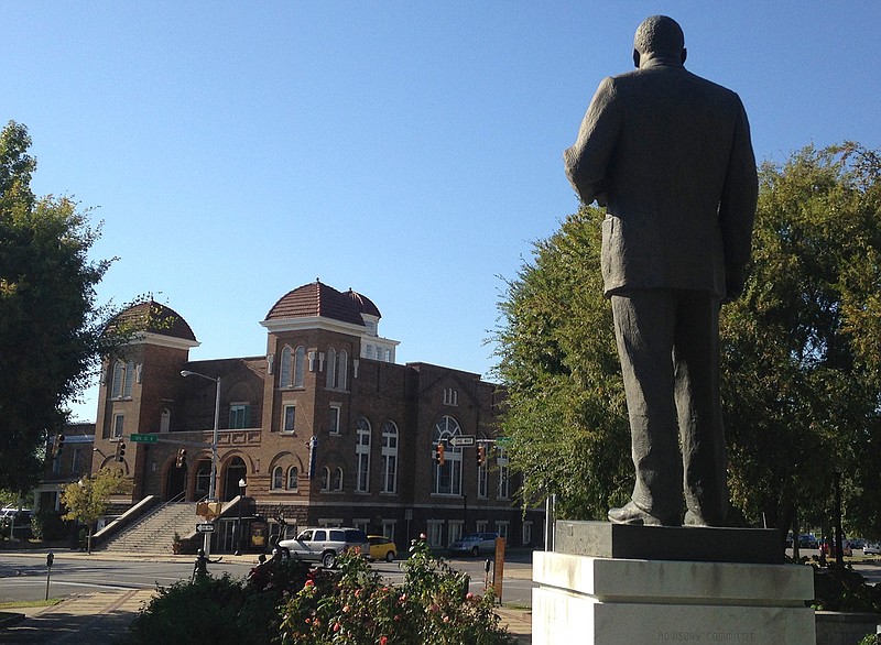 In this Oct. 15, 2015, file photo, a statue of Rev. Martin Luther King, Jr. overlooks the 16th Street Baptist Church in Birmingham, Ala., where advocates say officials are doing a good job at preserving sites links to civil rights. The site is among about 130 locations in 14 states being promoted as part of the new U.S. Civil Rights Trail, which organizers hope will boost tourism in the region.