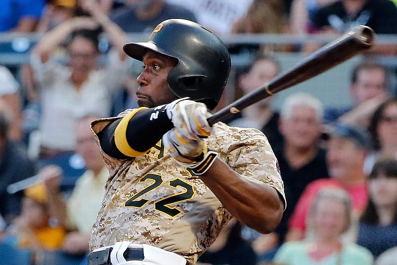 In this Aug. 3, 2017, file photo, Pittsburgh Pirates' Andrew McCutchen watches his RBI-single off Cincinnati Reds starting pitcher Sal Romano during the third inning of a baseball game in Pittsburgh. The Giants acquired McCutchen from the Pirates for right-hander Kyle Crick, minor league outfielder Bryan Reynolds and $500,000 in international signing bonus allocation.