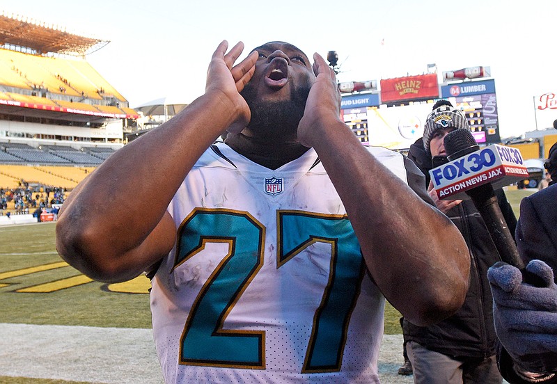 Jacksonville Jaguars running back Leonard Fournette (27) celebrates as he walks off the field following a 45-42 win over the Pittsburgh Steelers in an NFL divisional football AFC playoff game in Pittsburgh, Sunday, Jan. 14, 2018.