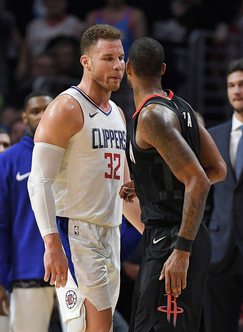 Los Angeles Clippers forward Blake Griffin, left, and Houston Rockets forward Trevor Ariza have words before both of them were ejected in the closing seconds of an NBA basketball game, Monday, Jan. 15, 2018, in Los Angeles. The Clippers won 113-102.