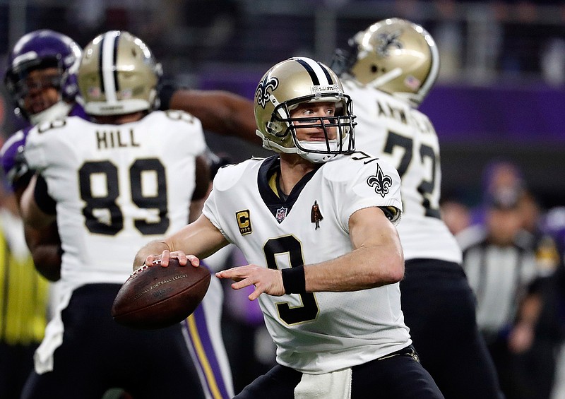 New Orleans Saints quarterback Drew Brees (9) throws against the Minnesota Vikings during the first half of an NFL divisional football playoff game in Minneapolis, Sunday, Jan. 14, 2018. 