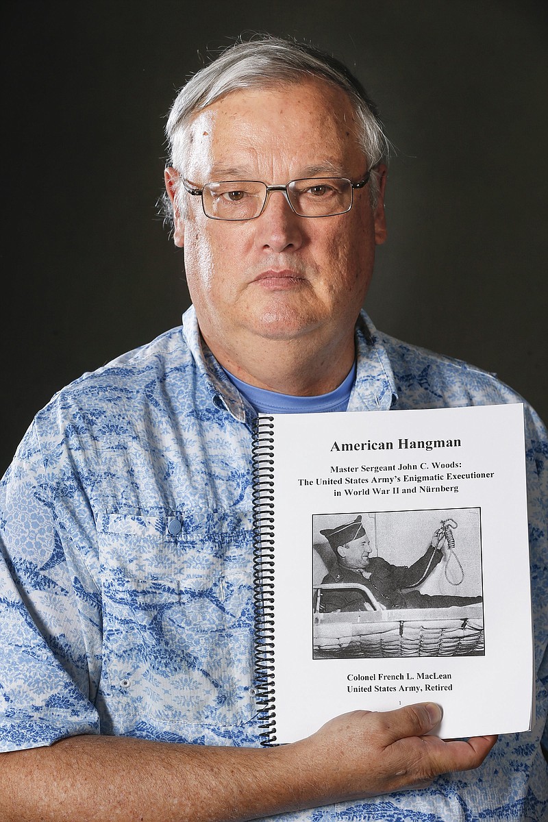 Colonel (Ret.) French MacLean with a draft of his upcoming book, "American Hangman" about Master Sgt. John Woods, who was the hangman at the Nuremberg Trials. (Fernando Salazar/Wichita Eagle/TNS)