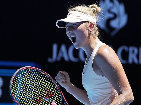 Marta Kostyuk celebrates a point win against Olivia Rogowska during their second round match Wednesday at the Australian Open in Melbourne, Australia.