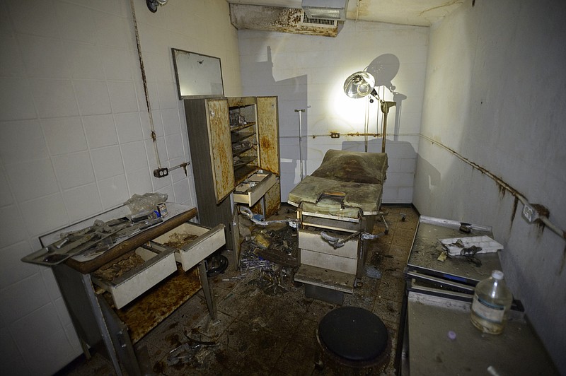 In this Tuesday, Sept. 26, 2017 photo, an infirmary complete with a medical bed and medical instruments is seen inside a Cold War era Civil Defense bunker in New Orleans. Relics from the Cold War, the aging shelters that once numbered in the thousands in schools, courthouses and churches haven't been maintained. And conventional wisdom has changed about whether such a shelter system is necessary in an age when an attack is more likely to come from a weak rogue state or terrorist group rather than a superpower.