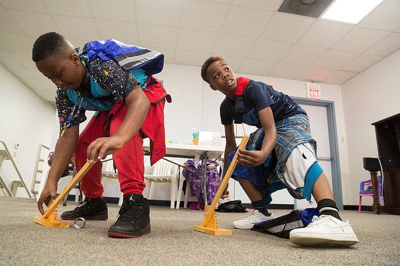 Martaevious Jackson and Kerwin Hooper take part in Tinker Fest last May at Discovery Place. The Texarkana Museums System has a Boredom Buster program for children on the second, third and fourth Saturdays of each month, and Tinkerfest will return in May. (Gazette file photo)
