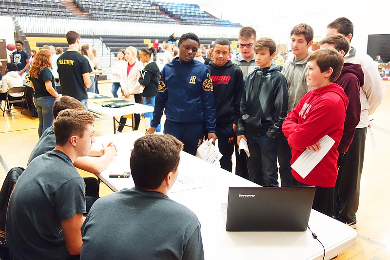 Fulton Middle School eighth-grade students on Friday, Jan. 19, 2018, got a taste of high school during Stepping Up to Success day. The Fellowship of Christian Athletes table, pictured here, proved to be especially popular.