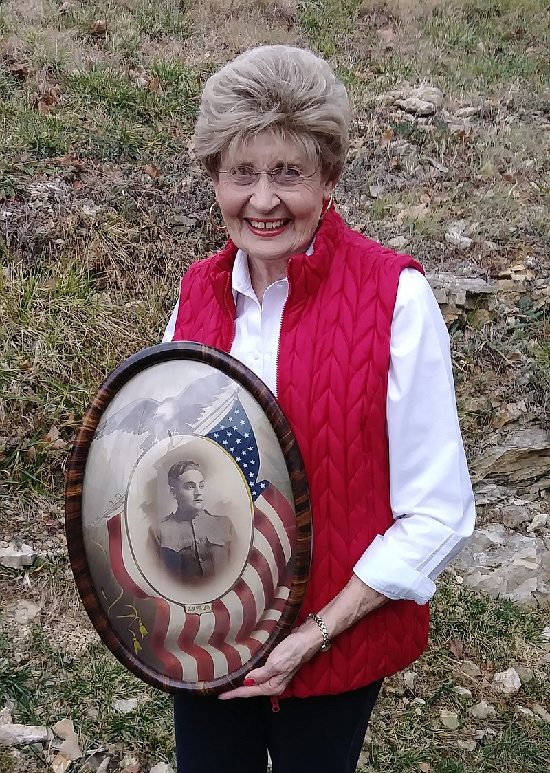 <p>Courtesy of Jeremy P. Amick</p><p>Jefferson City resident Dot Baker holds a portrait of her great-uncle, George Florea. A native of northeast Missouri, Florea was inducted into the U.S. Army in 1917 and was killed during WWI.</p>