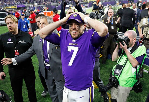 Vikings quarterback Case Keenum celebrates following a 29-24 win against the Saints in Sunday's NFC divisional playoff game in Minneapolis.