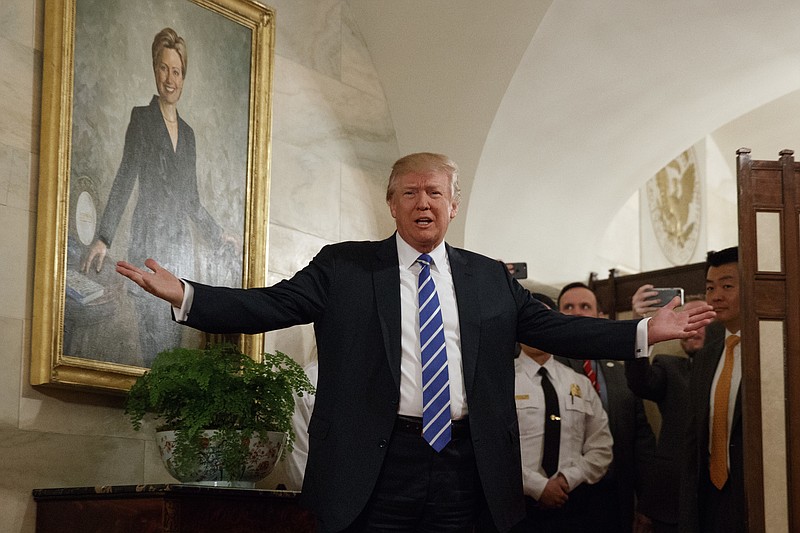 President Donald Trump greets visitors touring the White House in Washington, Tuesday, March 7, 2017. (AP Photo/Evan Vucci, File)