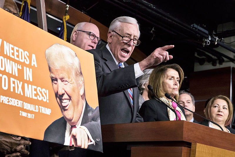 House Minority Whip Steny Hoyer, D-Md., center, joined from left by, Rep. Joseph Crowley, D-N.Y., House Minority Leader Nancy Pelosi, D-Calif., and Rep. Linda Sanchez, D-Calif., hold a news conference on the first morning of a government shutdown after a divided Senate rejected a funding measure last night, at the Capitol in Washington, Saturday, Jan. 20, 2018. (AP Photo/J. Scott Applewhite)