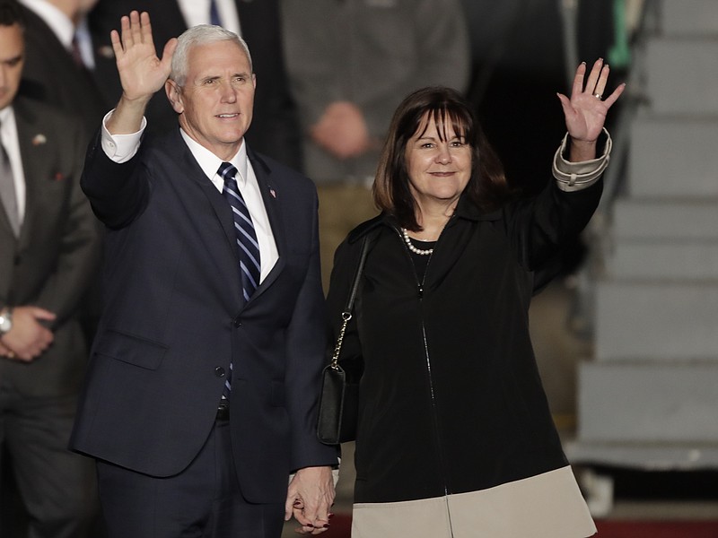 U.S. Vice President Mike Pence and his wife Karen wave as they landed at Tel Aviv airport Sunday, Jan. 21, 2018. Pence will pay a three day visit to Israel. (AP Photo/Tsafrir Abayov)