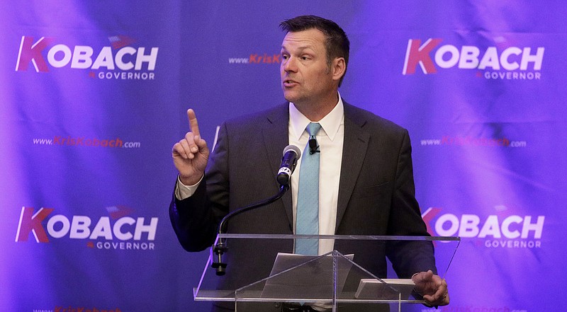 FILE - In this Nov. 28, 2017, file photo, Kansas Secretary of State Kris Kobach addresses the crowd during a fundraiser for his campaign for governor featuring Donald Trump Jr., in Overland Park, Kan. Kobach, the former vice chairman of the Trump voter fraud commission, said previously that he planned to advise Homeland Security on the commission’s work. In mid-January 2018, he said he has not had any communication with the department but remains in contact with the White House. (AP Photo/Charlie Riedel, File)
