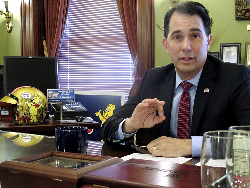 In this Friday, Jan . 19, 2017, photo, Wisconsin Gov. Scott Walker discusses health care-related proposals he will ask the Legislature to approve in Madison, Wis. (AP Photo/Scott Bauer)