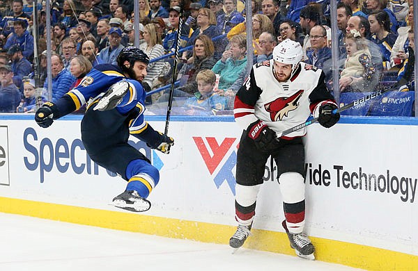 Coyotes center Zac Rinaldo knocks down Blues right wing Chris Thorburn in the second period of Saturday night's game in St. Louis.