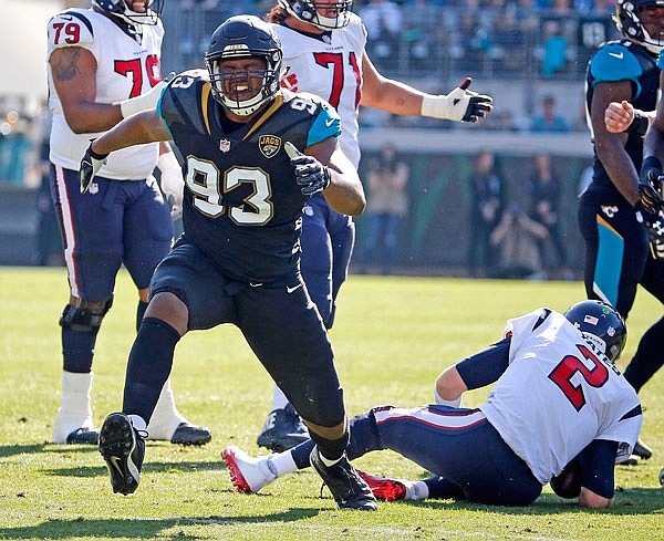 In this Dec. 17, 2017, file photo, Jaguars defensive lineman Calais Campbell celebrates after sacking Texans quarterback T.J. Yates during a game in Jacksonville, Fla.