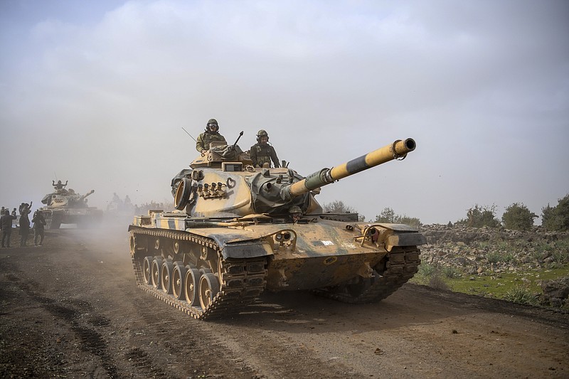 Turkish army tanks enter Afrin, an enclave in northern Syria controlled by U.S.-allied Kurdish fighters, in Hassa, Hatay, Turkey, Monday, Jan. 22, 2018. Turkey's President Recep Tayyip Erdogan has said his country will "not take a step back" from its military operation on Afrin. Speaking in Ankara on Monday_the third day of the operation— Erdogan said Turkey's "fundamental goal" is ensuring national security, preserving Syria's territorial integrity and protecting the Syrian people.(AP Photo)