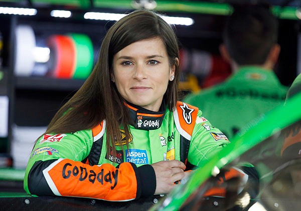 In this May 23, 2015, file photo, NASCAR driver Danica Patrick waits by her car before practice at Charlotte Motor Speedway in Concord, N.C.