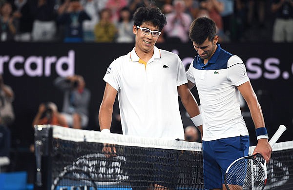 Chung Hyeon is congratulated by Novak Djokovic after winning their fourth-round match Monday at the Australian Open in Melbourne, Australia.