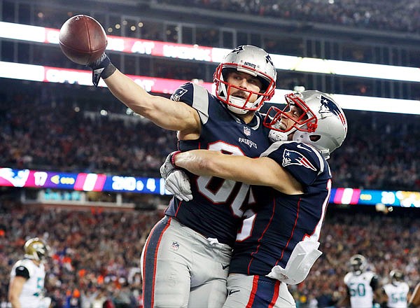 Patriots wide receiver Danny Amendola (left) celebrates his touchdown catch with Chris Hogan during the second half of Sunday's AFC championship game against the Jaguars in Foxborough, Mass.