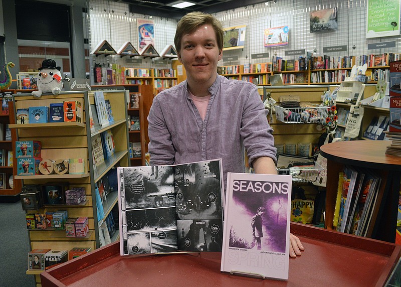 Mark Wilson/News Tribune
Jefferson City based graphic novelist Nandor Fox Shaffer, who published his first graphic novel, SEASONS (part of a four-part series), shows off the fruits of his labor at Downtown Book & Toy II at the Capital Mall. 