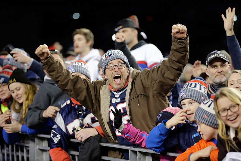 New England Patriots fans cheer as the players walk off the field after the AFC championship NFL football game against the Jacksonville Jaguars, Sunday, Jan. 21, 2018, in Foxborough, Mass. The Patriots won 24-20. (AP Photo/David J. Phillip)