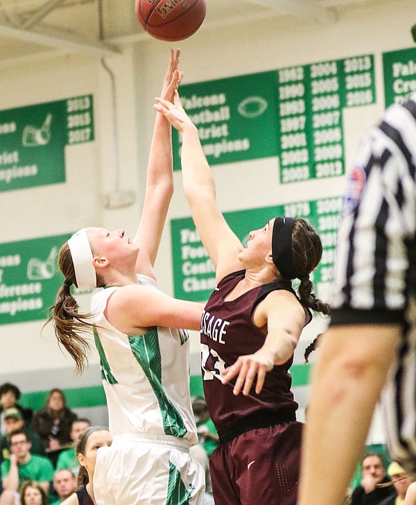 Abby Girard of Blair Oaks put up a shot over Kerrigan Gamm of School of the Osage during Monday night's game in Wardsville.