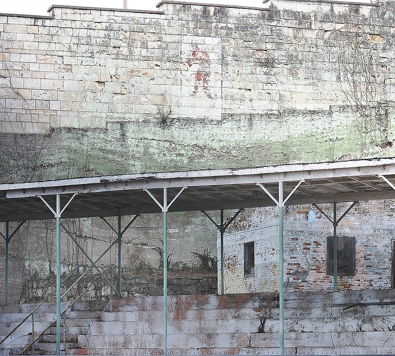 The painting of Sonny Liston on the inside of the stone walls of the former Missouri State Penitentiary has faded over the years so the Jefferson City Convention and Visitors Bureau is considering a project to restore it. 