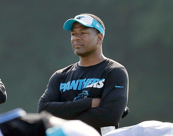 In this Aug. 3, 2015, file photo, Panthers assistant head coach Steve Wilks watches players warm up during training camp in Spartanburg, S.C. Wilks is the new head football coach of the Arizona Cardinals.