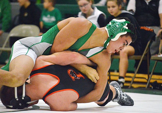 Eli Batiste of Blair Oaks (left) works on his Palmyra opponent in their 145-pound match during Tuesday night's wrestling quad in Wardsville.