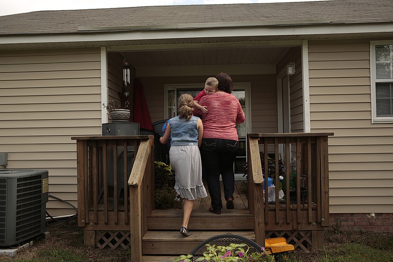 A family at home on the Ft. Bragg Army base in Fayetteville, N.C. By studying the body mass index of military families around the country, researchers have found evidence in support of the idea that obesity can be contagious. (Carolyn Cole/Los Angeles Times/TNS) 