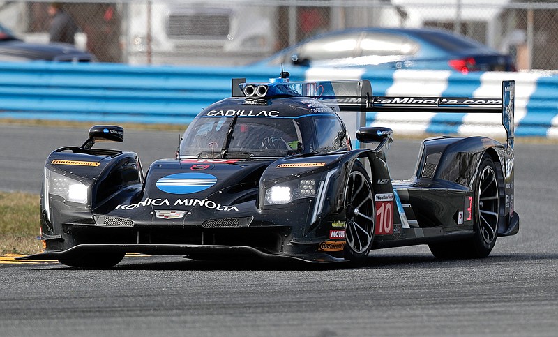 In this Friday, Jan. 5, 2018 photo, Jordan Taylor drives the No. 10 Konica Minolta Cadillac during testing for the IMSA 24 hour auto race at Daytona International Speedway, in Daytona Beach, Fla. Ricky and Jordan Taylor teamed together last year to win the Rolex 24 Hours, but this year Ricky moved to Team Penske, and the brothers will be competing against each other. (AP Photo/John Raoux)