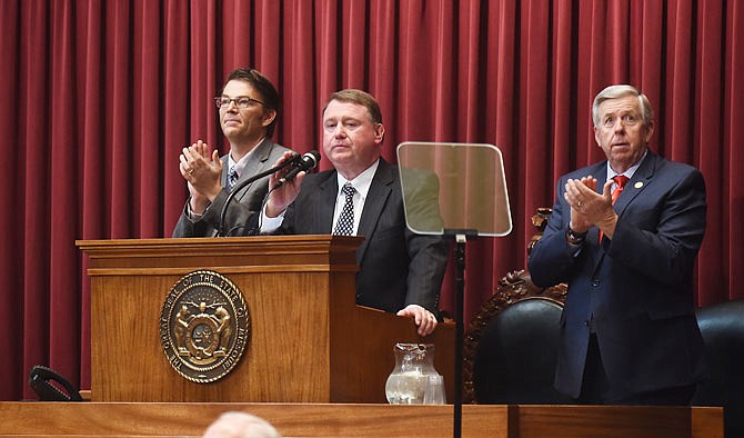 Chief Justice Zel Fischer, middle, delivered the annual State of the Judiciary speech Wednesday morning in the Missouri House of Chamber. He talked about the need for drug treatment courts and the benefits to individuals and society. Standing at left is House Speaker Todd Richardson and at right is Lt. Gov. Mike Parson.