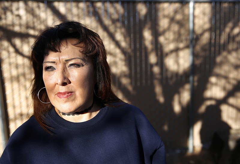 In this Thursday, Dec. 21, 2017 photo Joleen Valencia, who was held past her scheduled parole date while serving a drug-trafficking sentence, poses for a photo at The Pavilions, a residential re-entry program in Los Lunas, N.M., where she received treatment after her release from prison. New Mexico prison records show the state has held hundreds of inmates, like Valencia, past their projected parole dates under a practice widely known as “in-house parole.” (AP Photo/Eric Draper)
