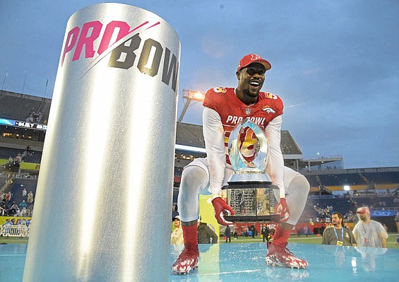 AFC linebacker Von Miller raises the Pro Bowl trophy Sunday after defeating the NFC 24-23, in Orlando, Fla.