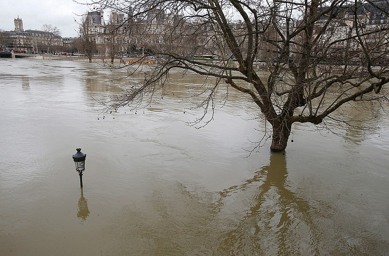 The banks of river Seine are flooded Monday in Paris. Floodwaters have reached a peak in Paris and are now threatening towns downstream along the rain-engorged river.