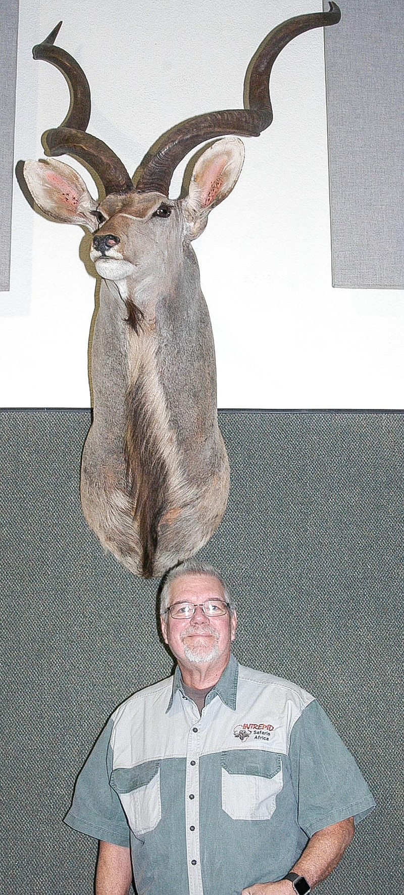 <p>Democrat photo</p><p> David A. Wilson</p><p>Mike Roux, who spoke to the men and boys at the wild game supper on “A Taste of Africa,” is shown with a mount of a kudu buck, which he took in South Africa.</p>